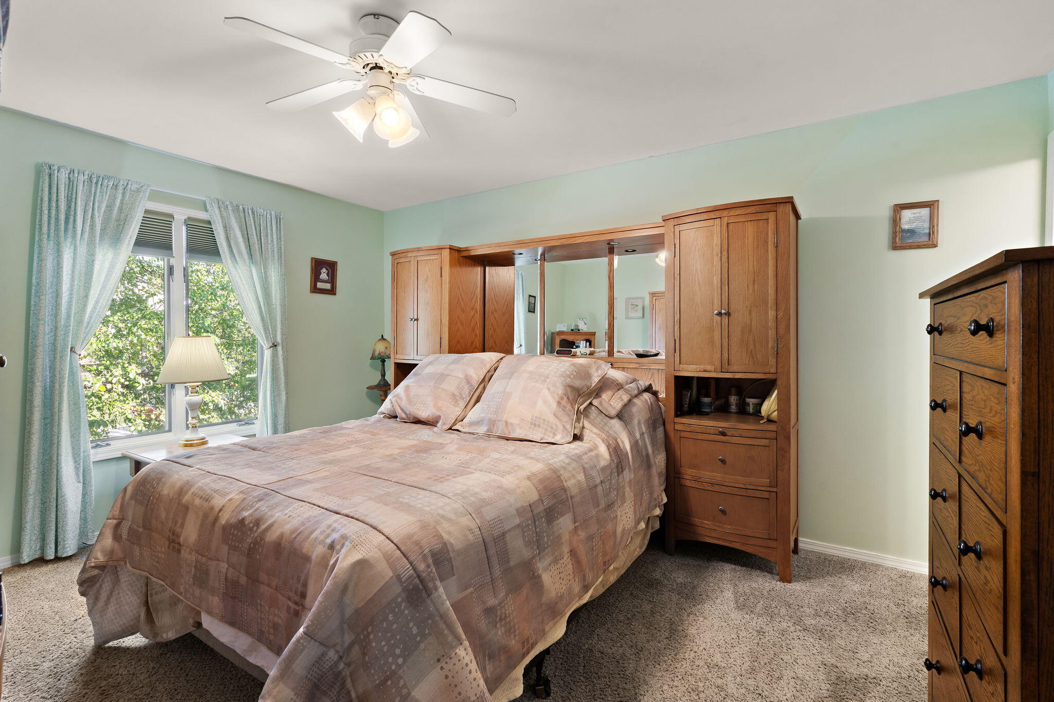 5015 Spinnaker Lane, Unit C Crown Point, IN 46307 - Photo 10 of 24 a bedroom with a bed dresser and a window