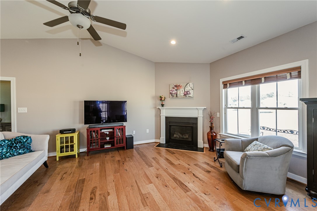 7622 Settlers Ridge Court Henrico, VA 23231 - Photo 11 of 43 a living room with furniture a fireplace and a flat screen tv
