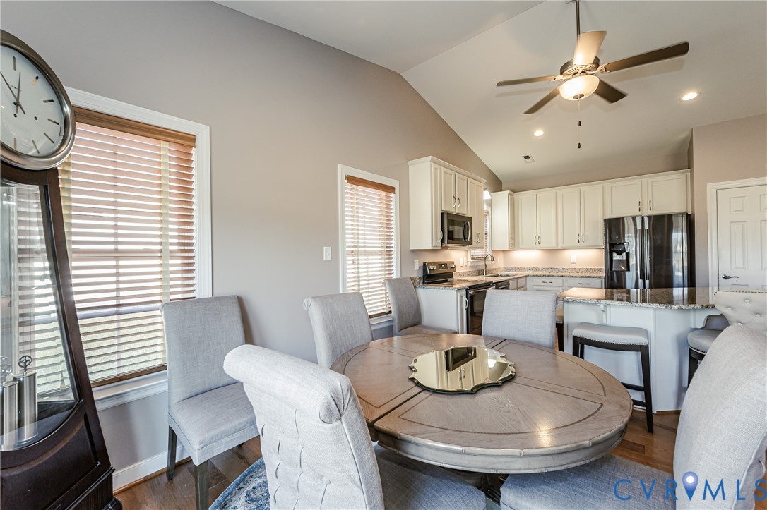 7622 Settlers Ridge Court Henrico, VA 23231 - Photo 18 of 43 a kitchen with a dining table and chairs