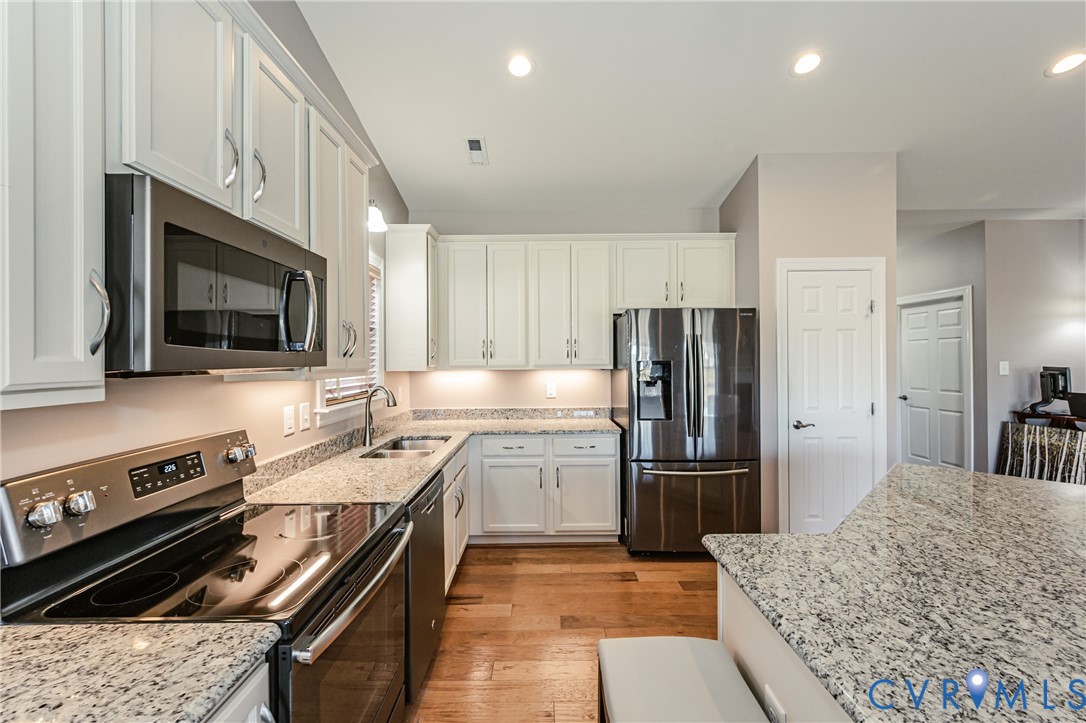 7622 Settlers Ridge Court Henrico, VA 23231 - Photo 19 of 43 a kitchen with a sink stainless steel appliances and cabinets