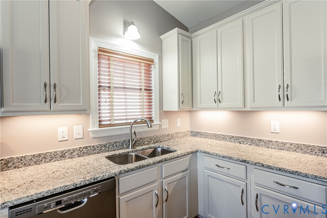 7622 Settlers Ridge Court Henrico, VA 23231 - Photo 20 of 43 a kitchen with granite countertop a sink and a window