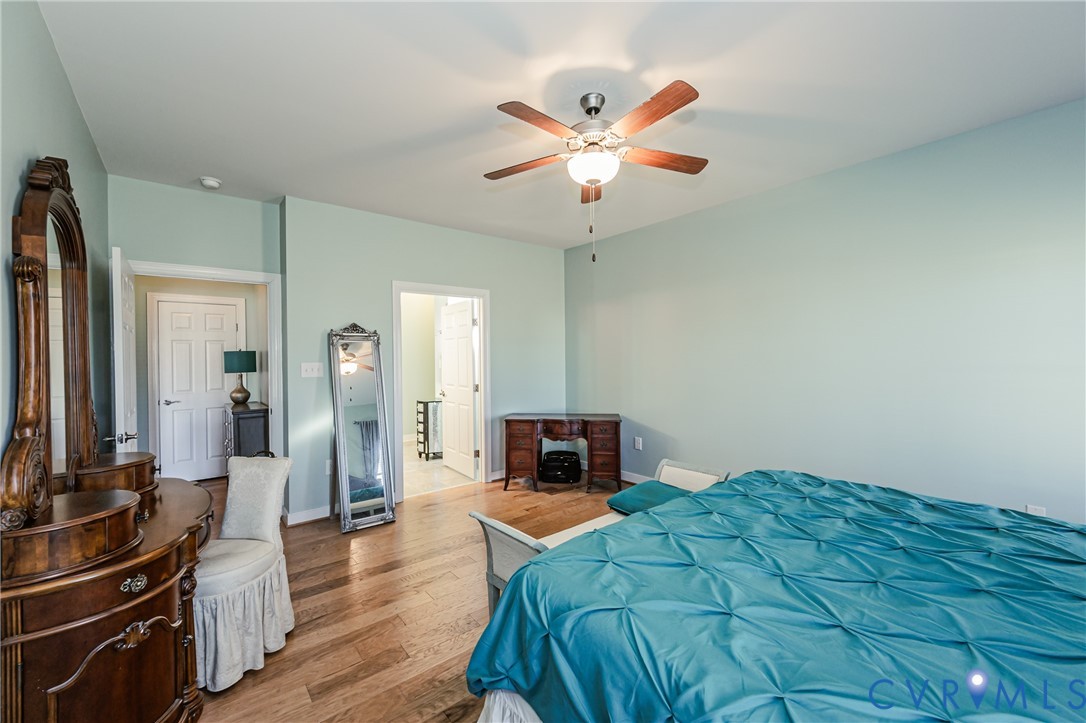 7622 Settlers Ridge Court Henrico, VA 23231 - Photo 22 of 43 a bedroom with a bed and a flat screen tv