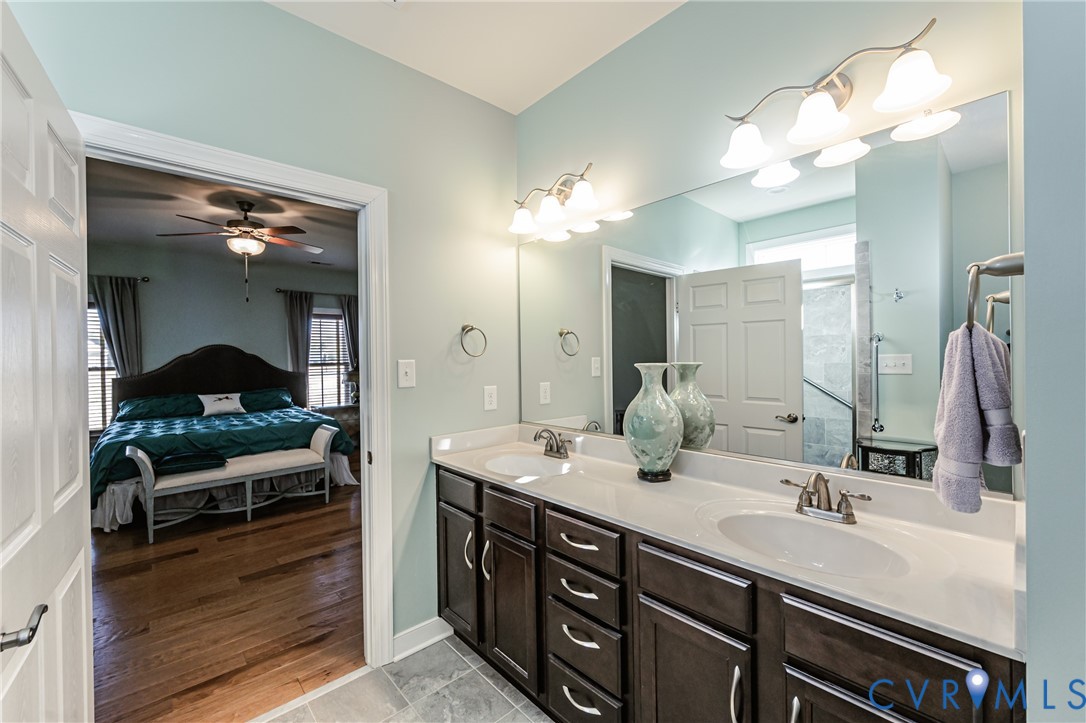 7622 Settlers Ridge Court Henrico, VA 23231 - Photo 23 of 43 a bathroom with a double vanity sink and a mirror