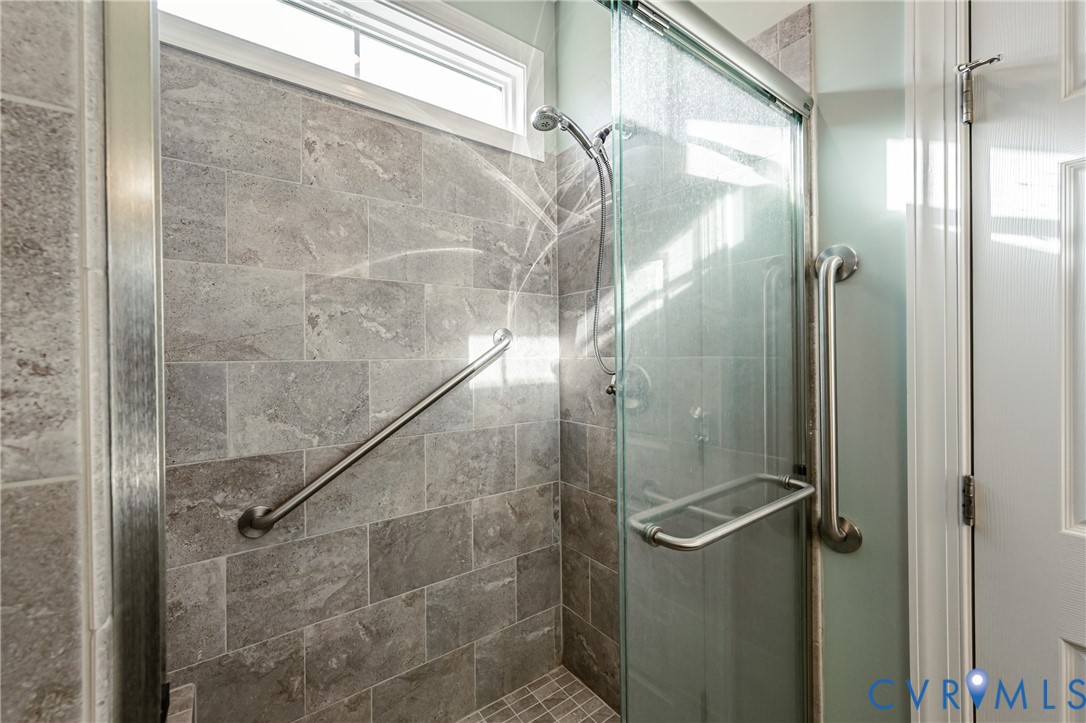 7622 Settlers Ridge Court Henrico, VA 23231 - Photo 24 of 43 a bathroom with a glass shower door