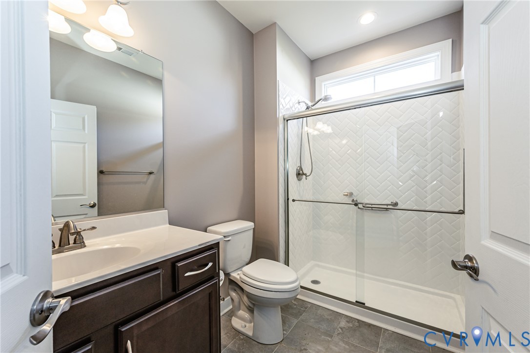 7622 Settlers Ridge Court Henrico, VA 23231 - Photo 30 of 43 a bathroom with a sink a toilet and shower