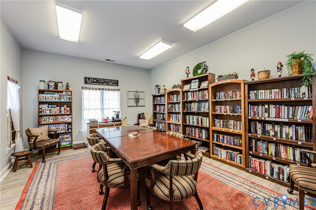 7622 Settlers Ridge Court Henrico, VA 23231 - Photo 39 of 43 a view of a dining room with furniture and a book shelf