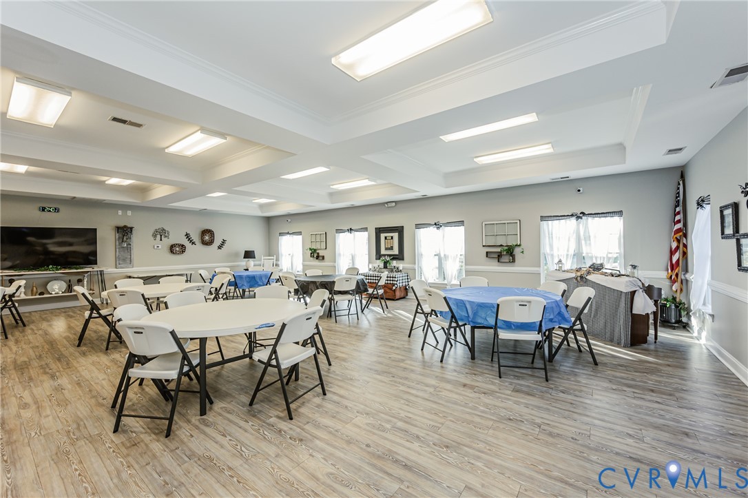 7622 Settlers Ridge Court Henrico, VA 23231 - Photo 40 of 43 a view of a dining room with furniture and wooden floor