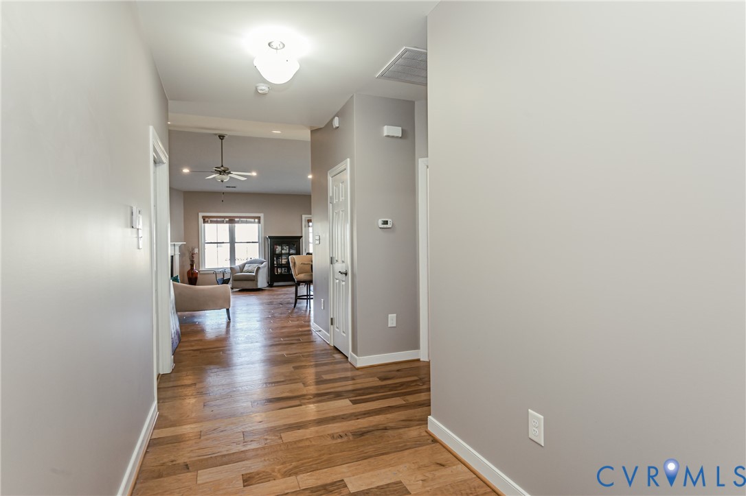 7622 Settlers Ridge Court Henrico, VA 23231 - Photo 7 of 43 a view of a hallway view with wooden floor and a living room