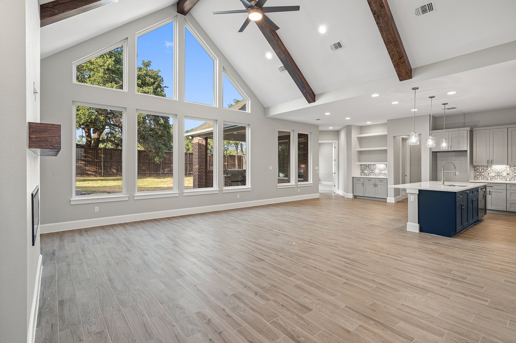 112 Axis Loop Georgetown, TX 78628 - Photo 6 of 39 a view of an empty room with a window and wooden floor