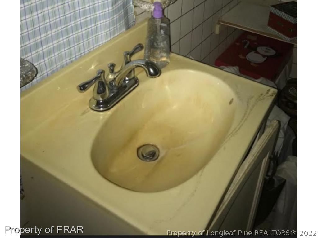 7414 Burnett Road Godwin, NC 28344 - Photo 5 of 9 a bathroom with a tub