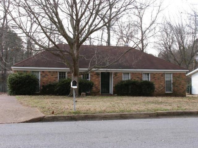 2913 Invergarry Road Memphis, TN 38128 - Photo 1 of 1 a front view of house with yard covered with trees