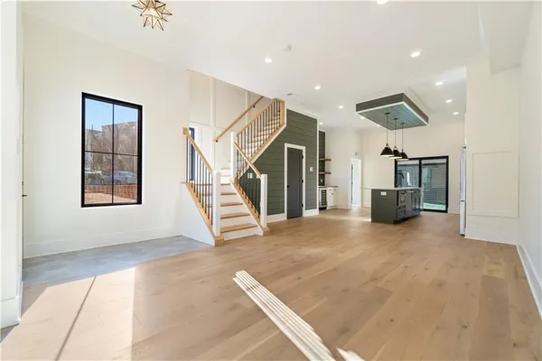 a view of entryway and hall with wooden floor