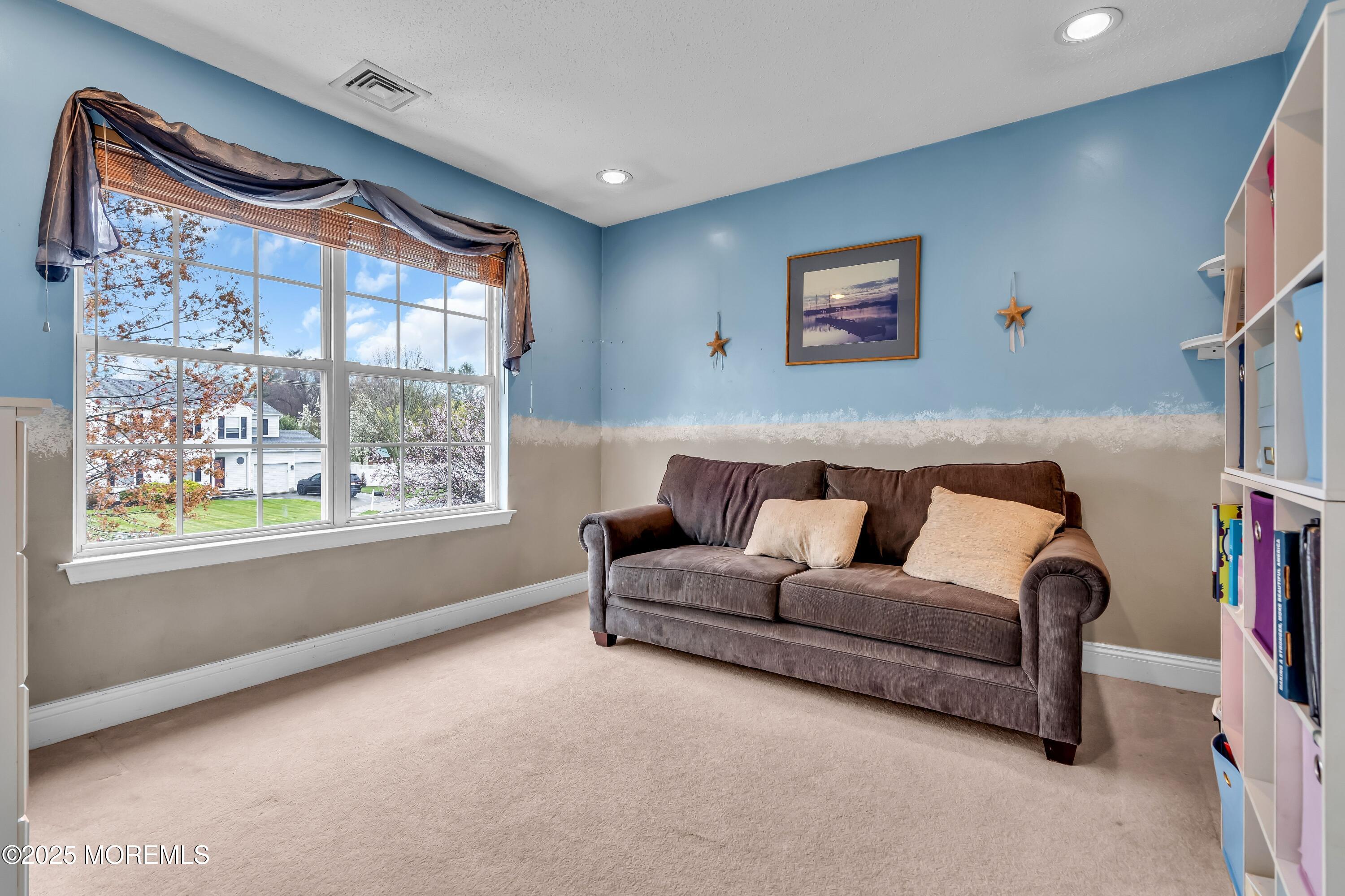 54 Crater Lake Road Howell, NJ 07731 - Photo 29 of 39 a living room with furniture and a large window