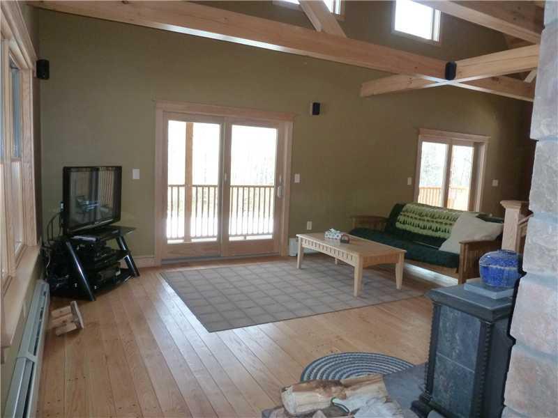 311 East Pond Road Smithfield, ME 04978 - Photo 3 of 26 Living Room. Wood stove and pretty...