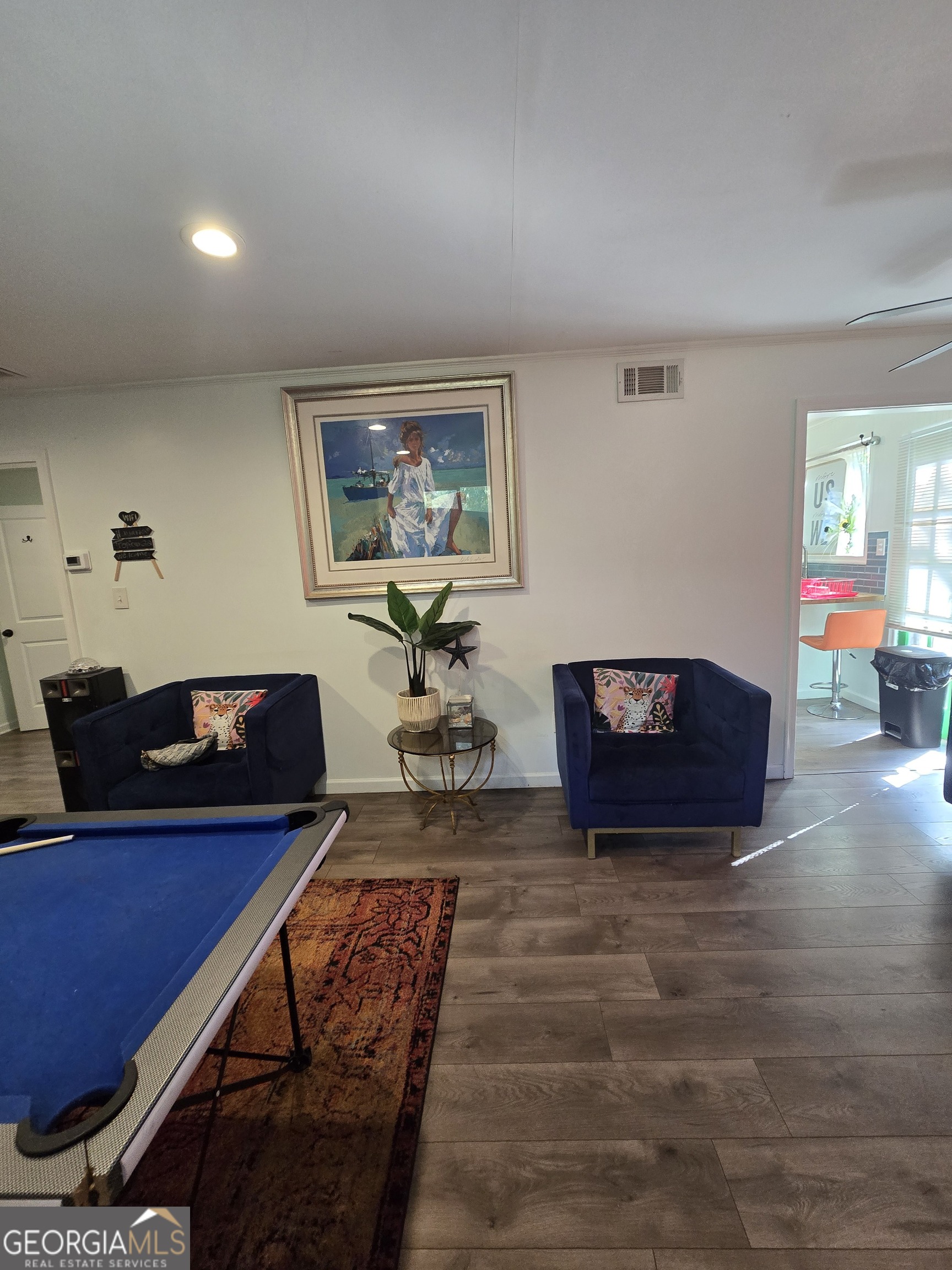 406 Pinelea Road Griffin, GA 30223 - Photo 27 of 53 a living room with furniture and a flat screen tv