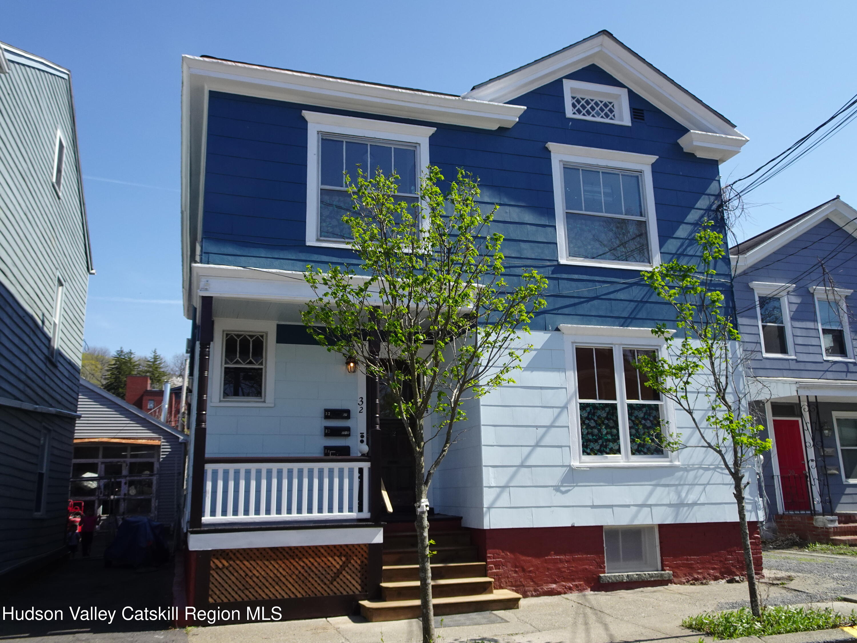32-34 8th Street, Unit 1 Hudson, NY 12534 - Photo 1 of 14 a front view of a house with garden