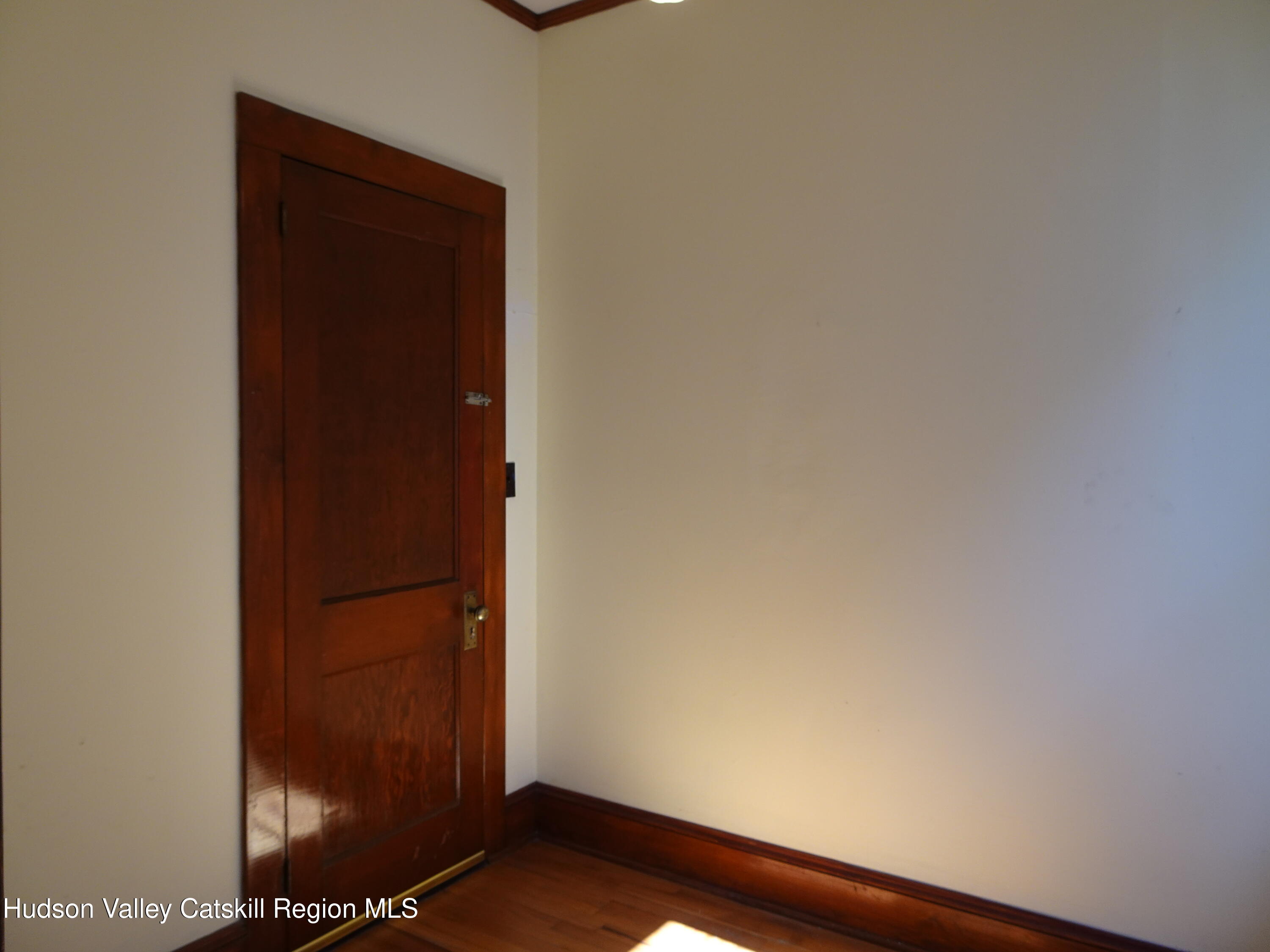 32-34 8th Street, Unit 1 Hudson, NY 12534 - Photo 14 of 14 an empty room with wooden floor