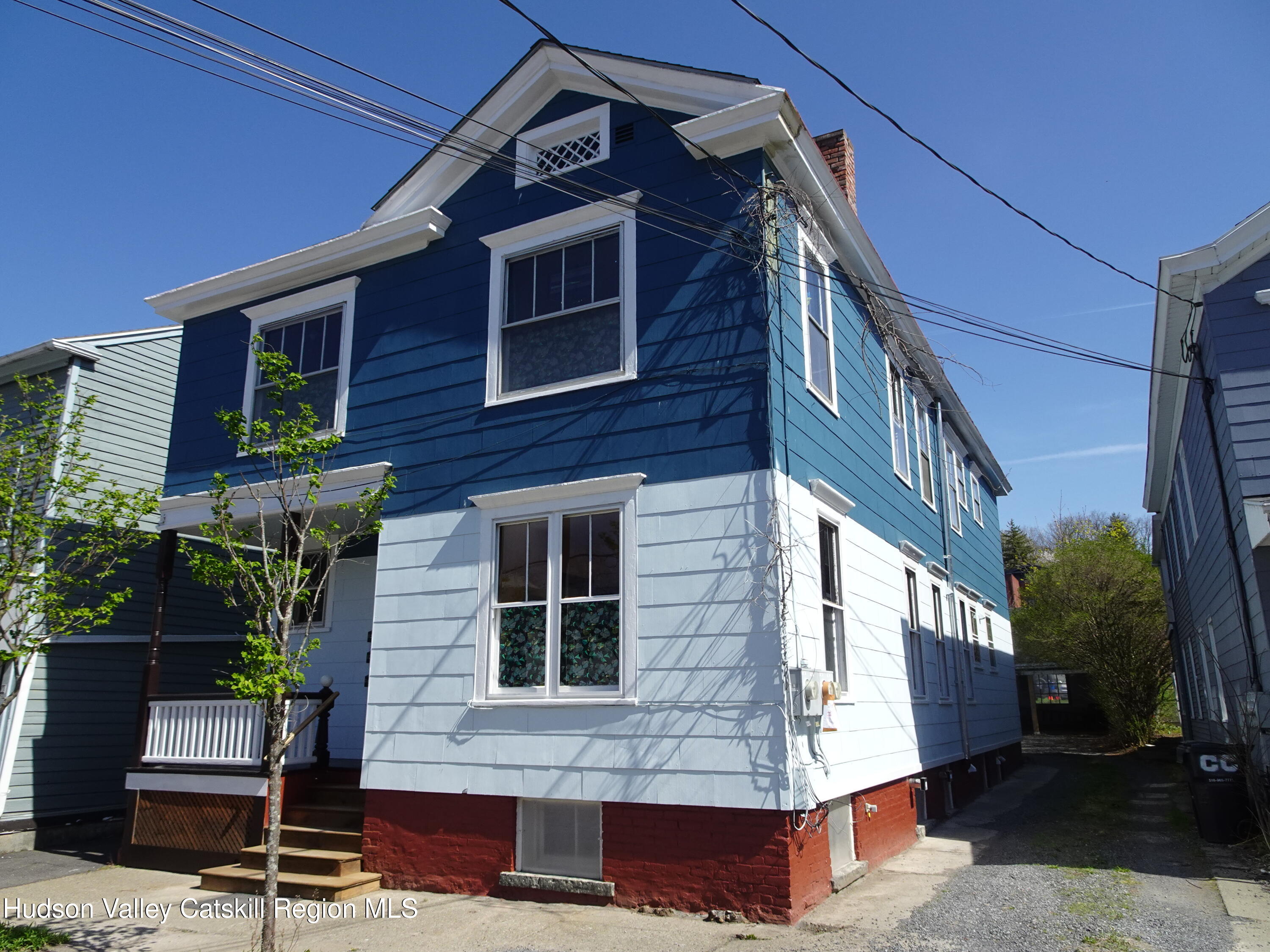 32-34 8th Street, Unit 1 Hudson, NY 12534 - Photo 2 of 14 a front view of a house with a yard