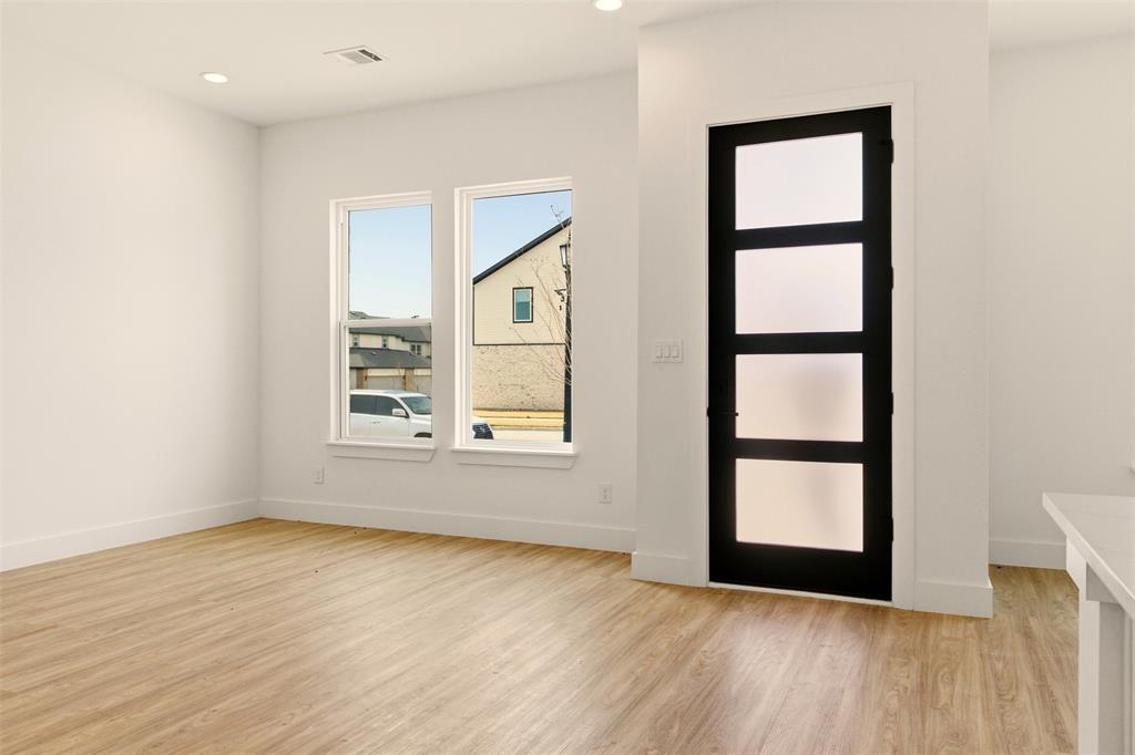 8902 Lowell Street Rowlett, TX 75089 - Photo 4 of 32 This room features light-colored flooring, white walls, and recessed lighting
