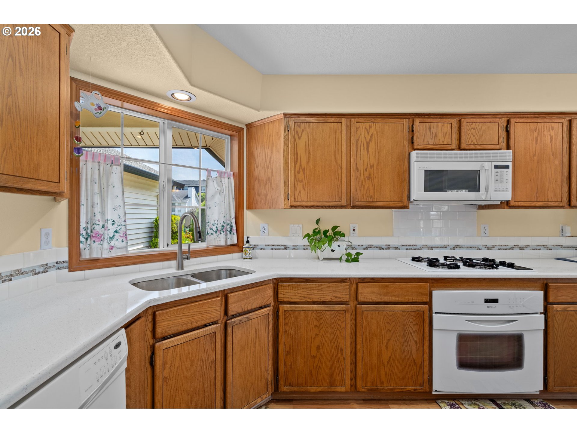 3081 Southwest 31st Street Gresham, OR 97080 - Photo 24 of 38 a kitchen with stainless steel appliances granite countertop a sink and a stove