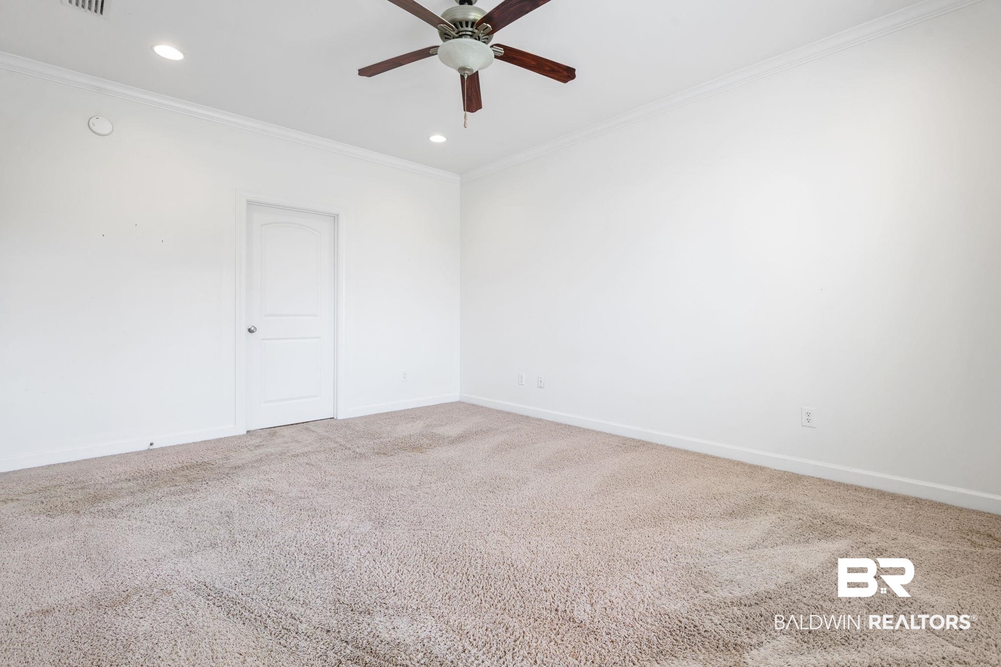 9730 Harmony Ridge Circle West Semmes, AL 36575 - Photo 14 of 38 Carpeted empty room featuring ceiling fan, ornamental molding, baseboards, and recessed lighting