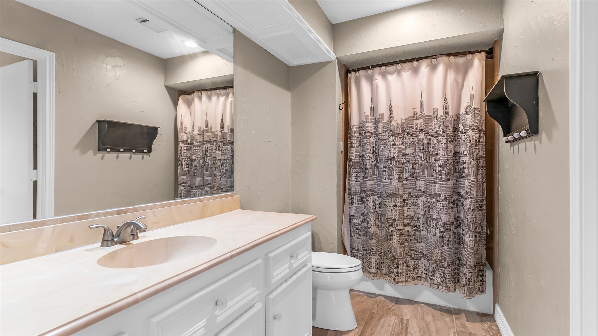 2607 Laurel Ridge Drive Houston, TX 77345 - Photo 32 of 47 a bathroom with a granite countertop sink toilet and shower