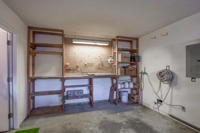 a room with cabinets and chair