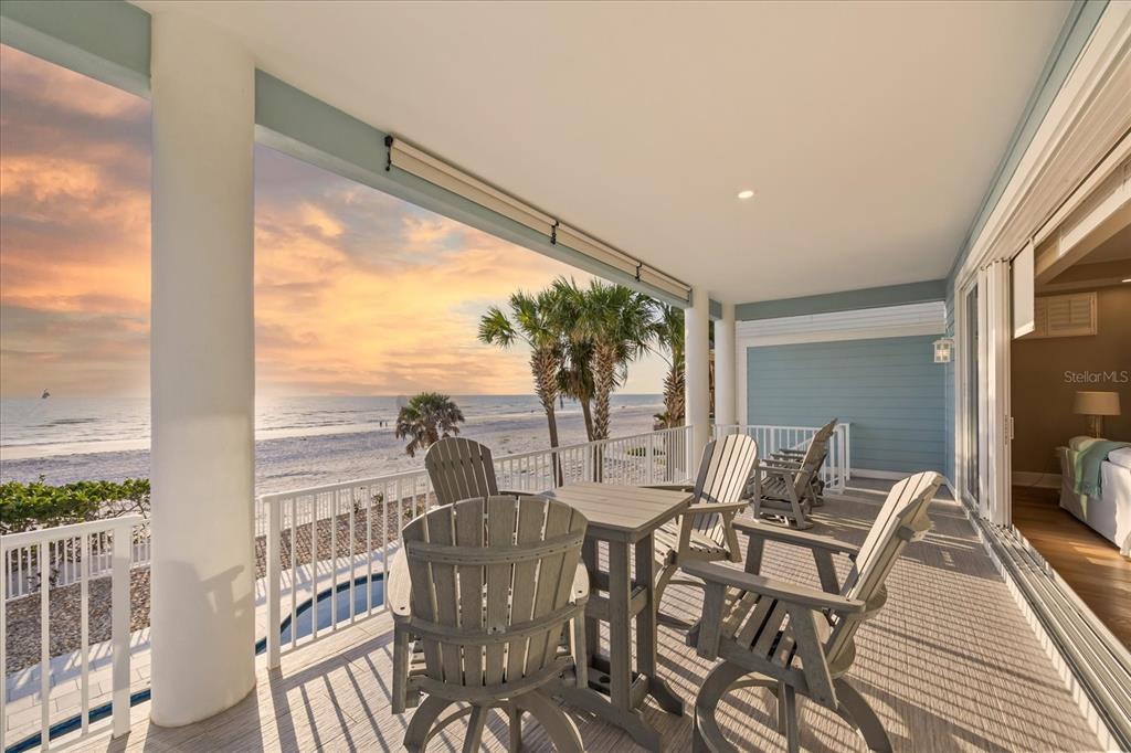 2 Gulf Boulevard Indian Rocks Beach, FL 33785 - Photo 13 of 79 a view of a dining room with furniture a chandelier and wooden floor
