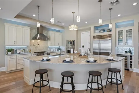 a view of a livingroom with furniture and floor to ceiling window