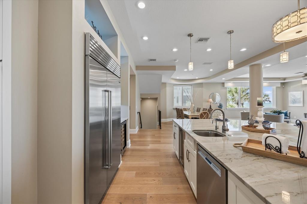 2 Gulf Boulevard Indian Rocks Beach, FL 33785 - Photo 21 of 79 a large kitchen with a large counter top appliances and cabinets