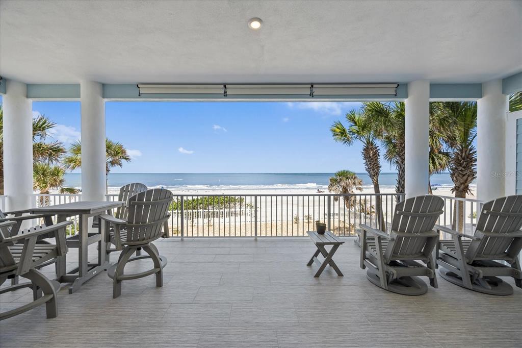 2 Gulf Boulevard Indian Rocks Beach, FL 33785 - Photo 26 of 79 a view of a livingroom with furniture and floor to ceiling window