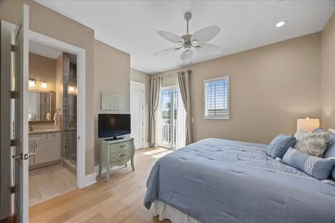 a view of a porch with furniture and floor to ceiling window