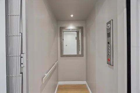 a bedroom with two beds and a large window