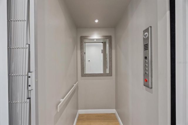 a bedroom with two beds and a large window