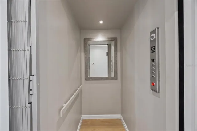 a bedroom with two beds and a large window