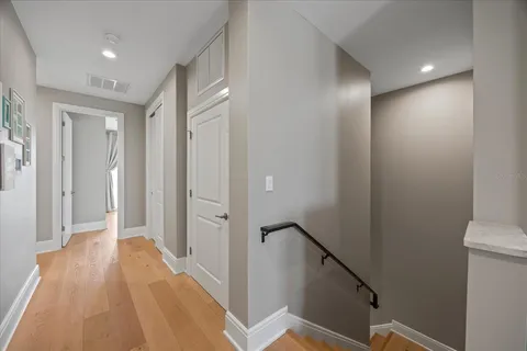 a bathroom with a granite countertop sink toilet and mirror