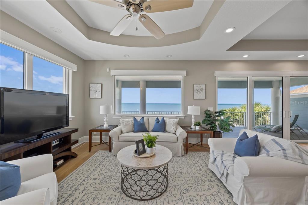 2 Gulf Boulevard Indian Rocks Beach, FL 33785 - Photo 46 of 79 a living room with furniture and a flat screen tv