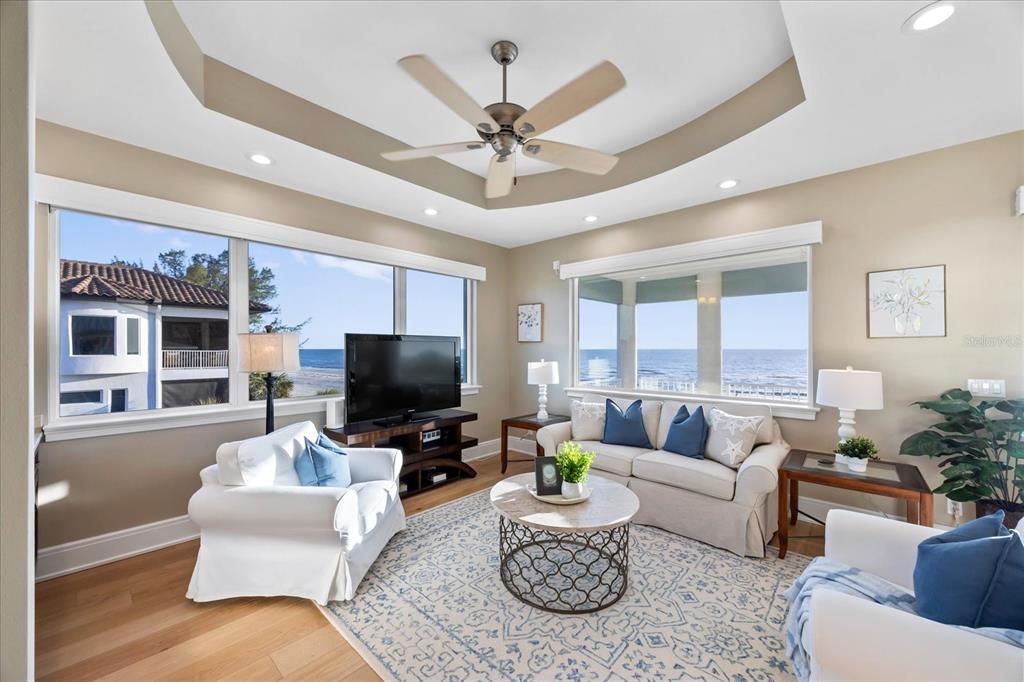 2 Gulf Boulevard Indian Rocks Beach, FL 33785 - Photo 55 of 79 a living room with furniture and a flat screen tv