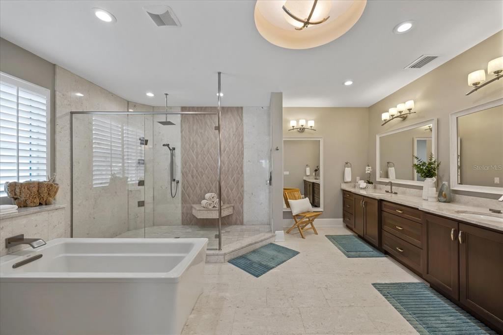 2 Gulf Boulevard Indian Rocks Beach, FL 33785 - Photo 59 of 79 a large spacious bathroom with a large tub shower and sink