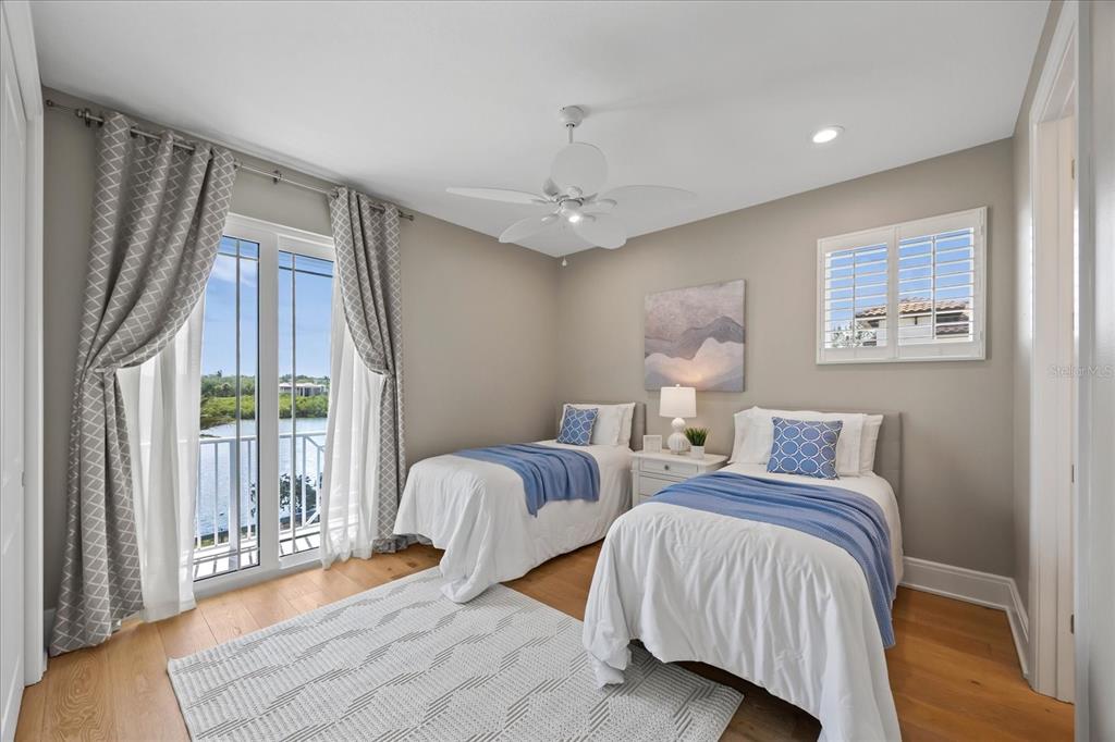 2 Gulf Boulevard Indian Rocks Beach, FL 33785 - Photo 64 of 79 a bedroom with two beds and a large window