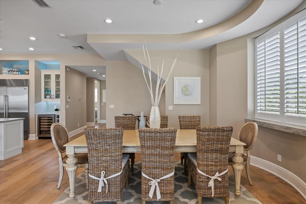 2 Gulf Boulevard Indian Rocks Beach, FL 33785 - Photo 7 of 79 a view of a dining room with furniture window and wooden floor