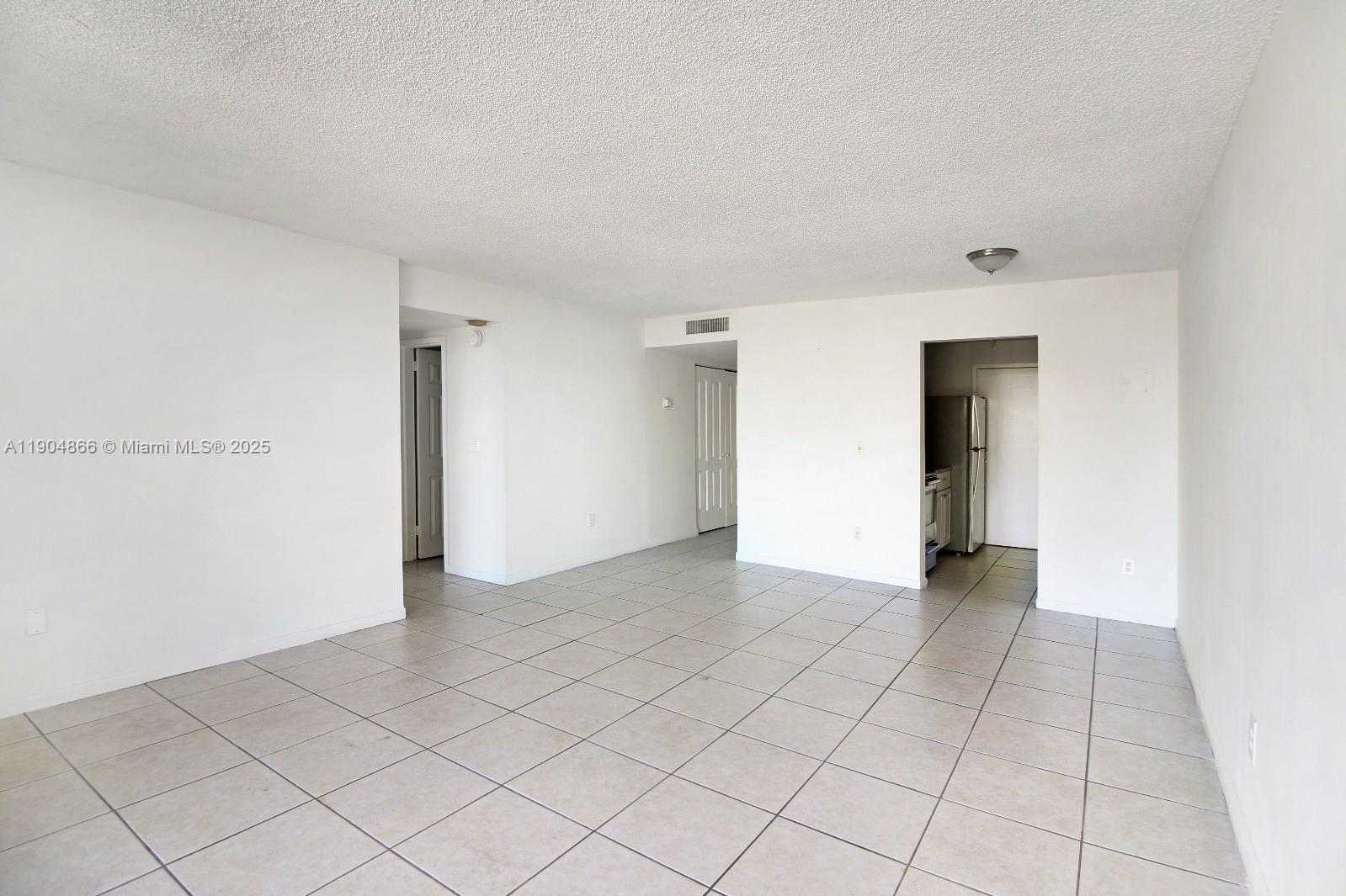 2350 Northeast 135th Street, Unit 1111 North Miami, FL 33181 - Photo 8 of 21 a view of an empty room