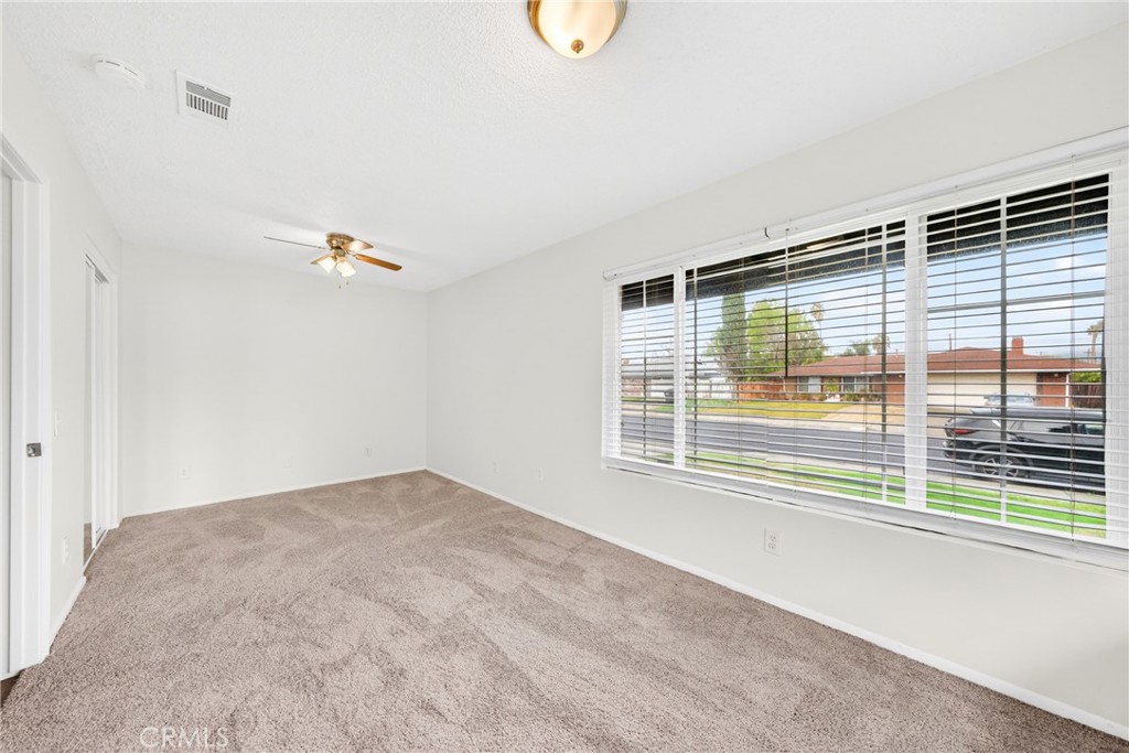 24867 Bower Street Moreno Valley, CA 92553 - Photo 14 of 46 a view of an empty room with a window