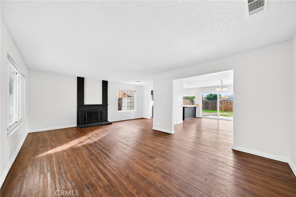 24867 Bower Street Moreno Valley, CA 92553 - Photo 2 of 46 a view of empty room with wooden floor