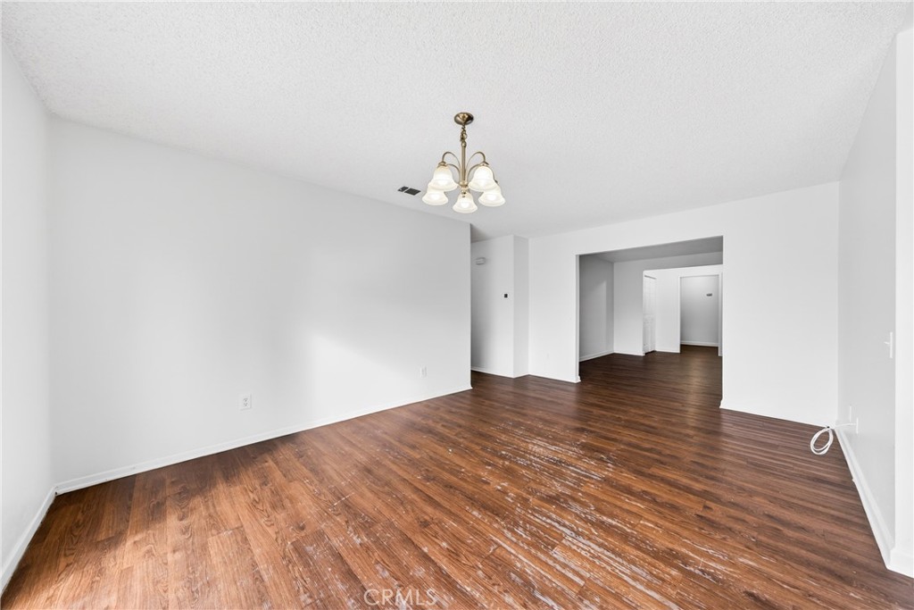 24867 Bower Street Moreno Valley, CA 92553 - Photo 27 of 46 a view of empty room with wooden floor and fan