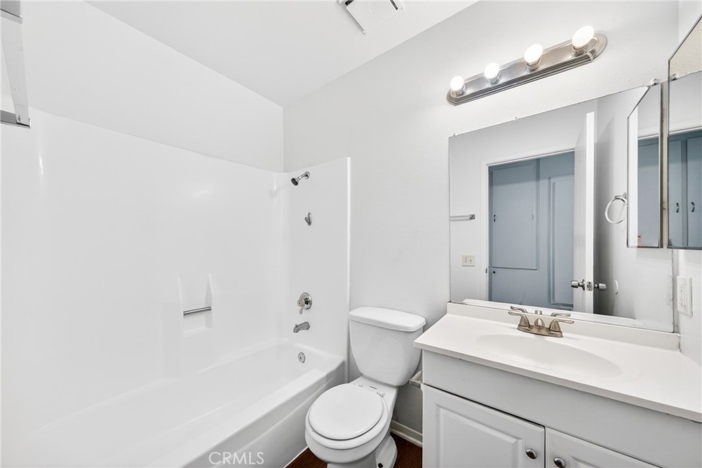 24867 Bower Street Moreno Valley, CA 92553 - Photo 29 of 46 a bathroom with a sink a toilet and shower