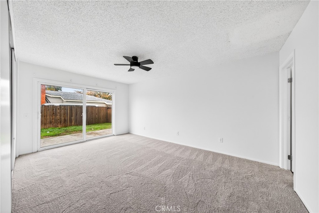 24867 Bower Street Moreno Valley, CA 92553 - Photo 31 of 46 an empty room with a glass door and shower