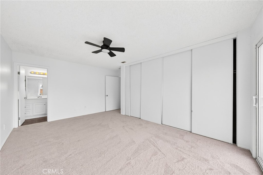 24867 Bower Street Moreno Valley, CA 92553 - Photo 34 of 46 a view of an empty room with a ceiling fan