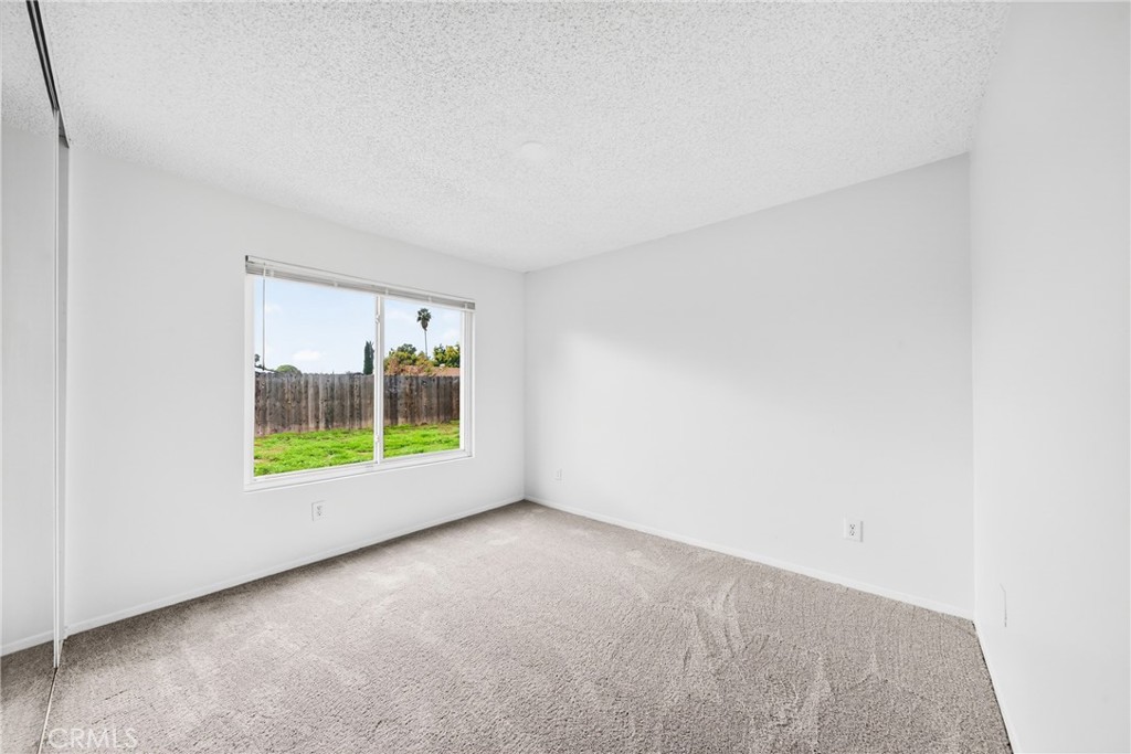 24867 Bower Street Moreno Valley, CA 92553 - Photo 39 of 46 a view of an empty room with a window