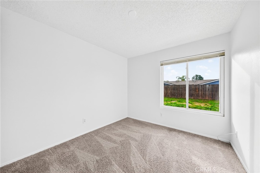24867 Bower Street Moreno Valley, CA 92553 - Photo 41 of 46 an empty room with a window